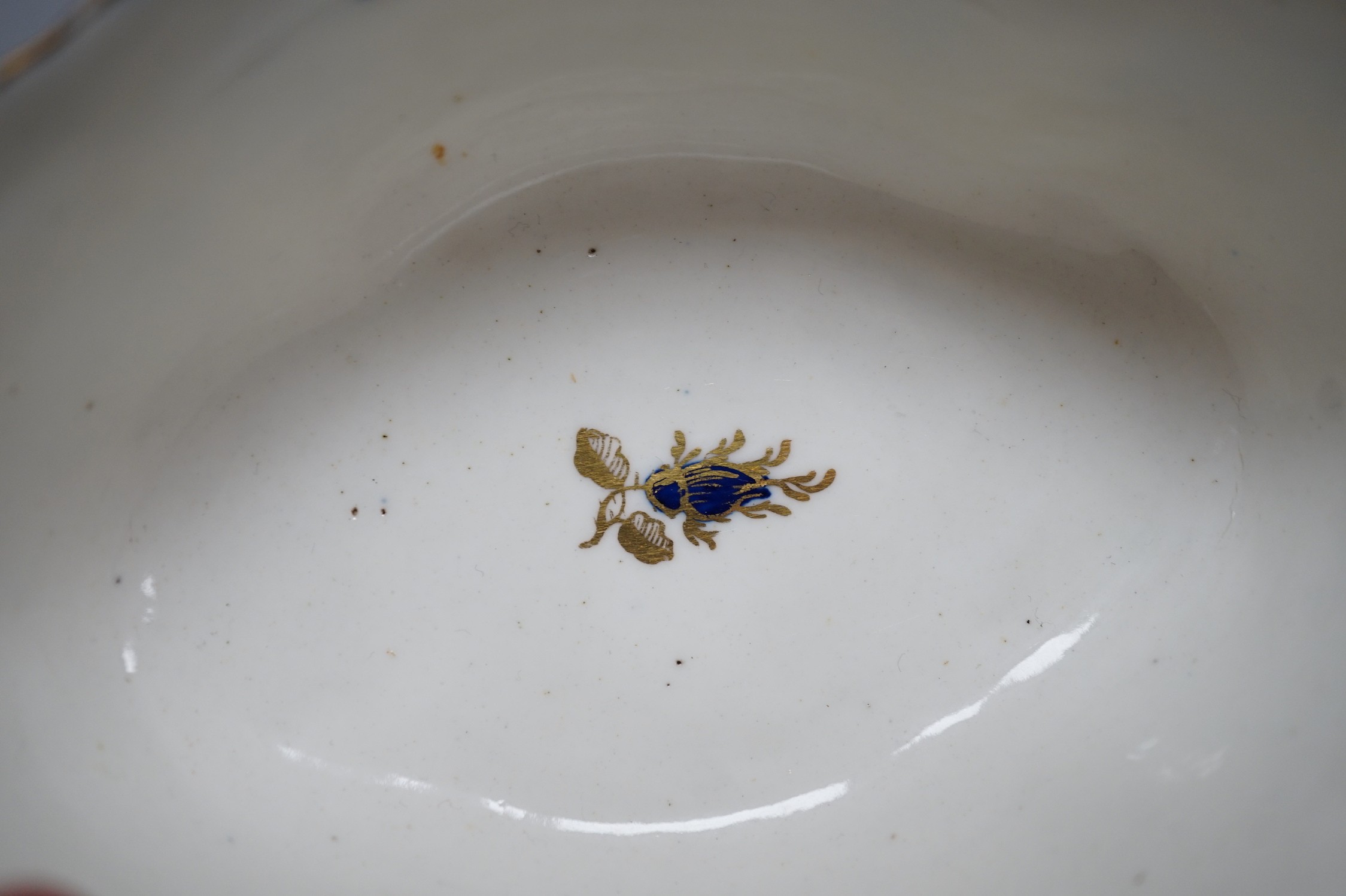 An 18th century Caughley tureen cover and stand with blue and gilt decoration, stand mis-fired to border, S mark to stand and base. 15cm wide